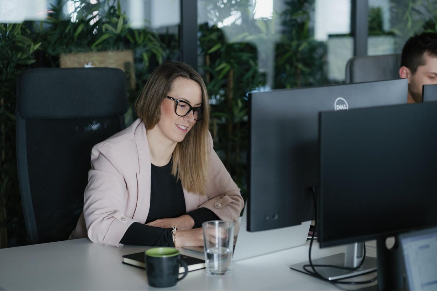 Q employee working on AI compliance.